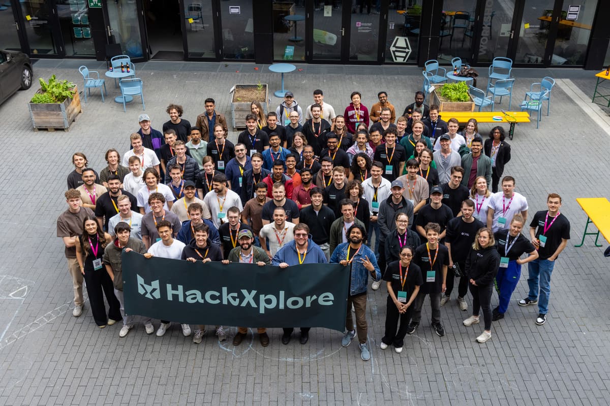 Group photo of HackXplore participants celebrating after the final presentations.